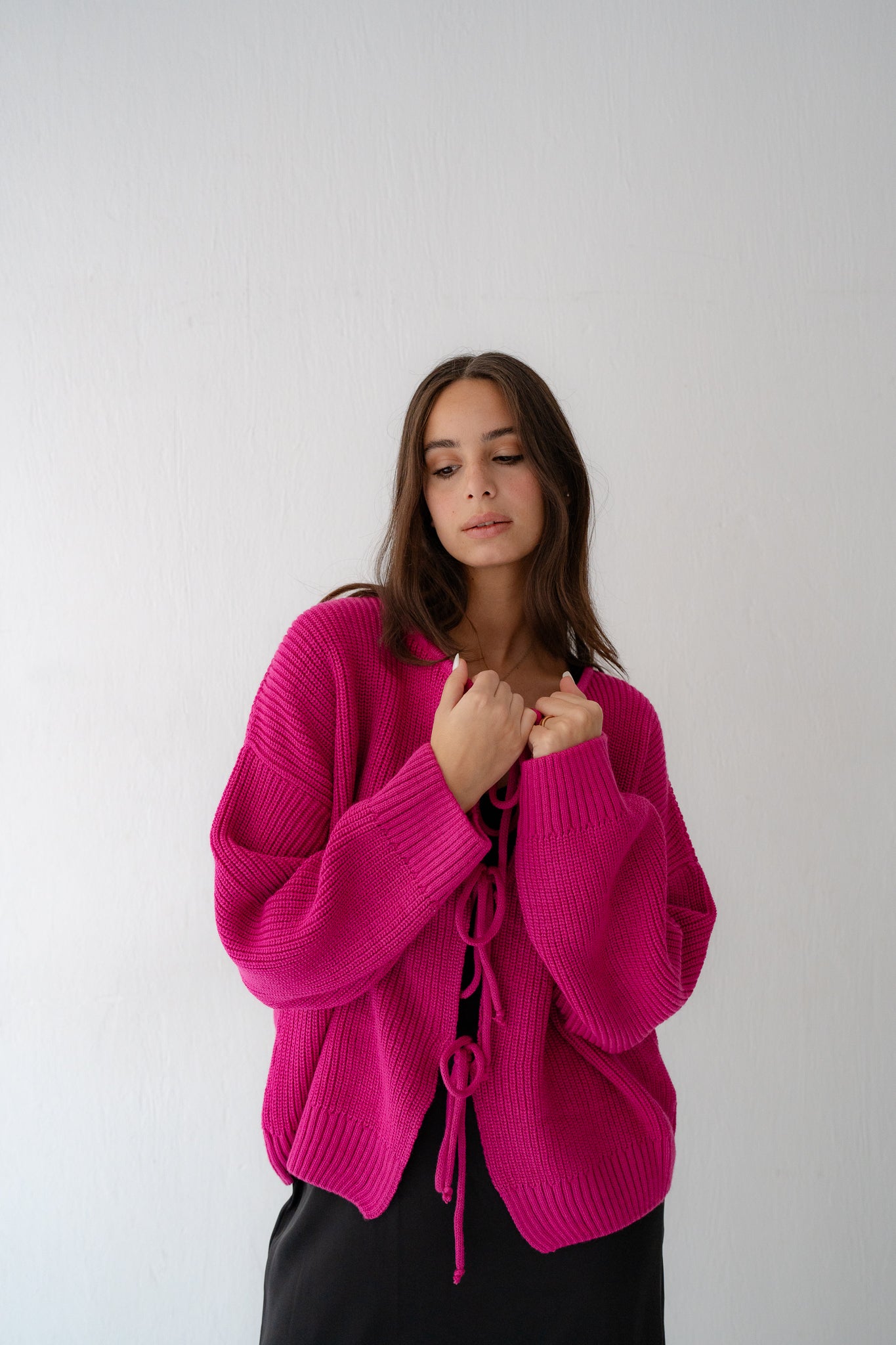 KNIT CARDIGAN WITH BOW IN FUCHSIA